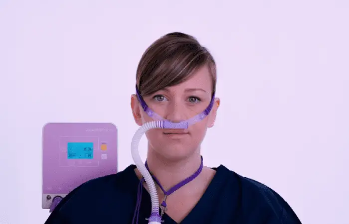 A woman with a nasal canula connected to the FD140 by Armstrong Medical A woman with a nasal canula connected to the FD140 by Armstrong Medical
