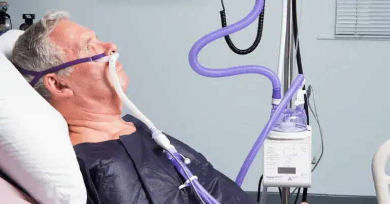 Image of a man receiving HFOT from a nasal cannula